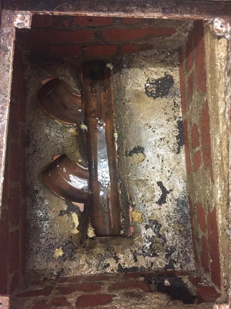 A blocked drain chamber after being cleared by K&M Group Drainage Ltd.